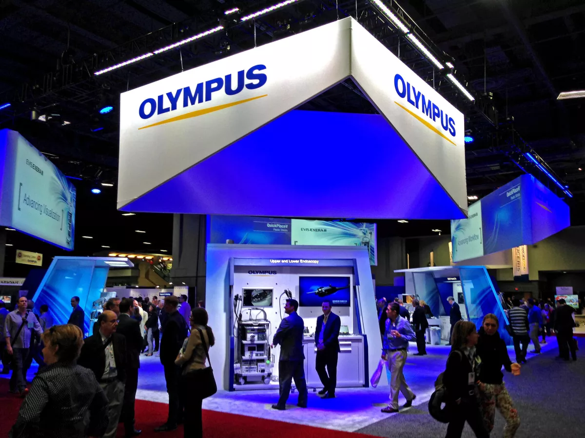 The blue-lit showcase for Olympus products on the exhibit floor at the Digestive Disease Week conference in Washington, D.C.
